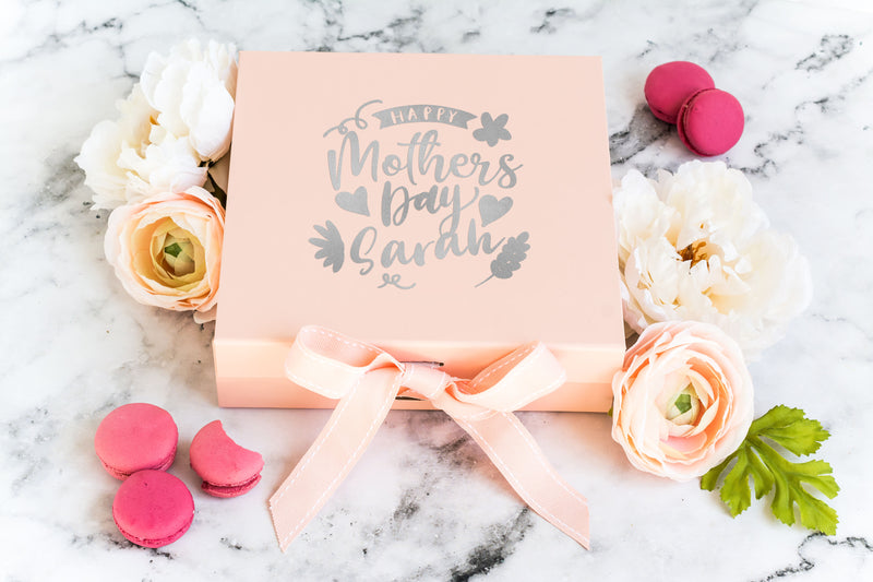 a mother's day gift box with flowers and macaroni and cheese