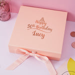 a pink birthday box with a pink ribbon