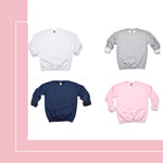 four different colored sweatshirts on a pink and white background