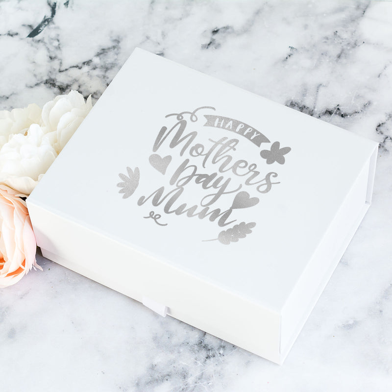 a mother's day box sitting on a marble surface