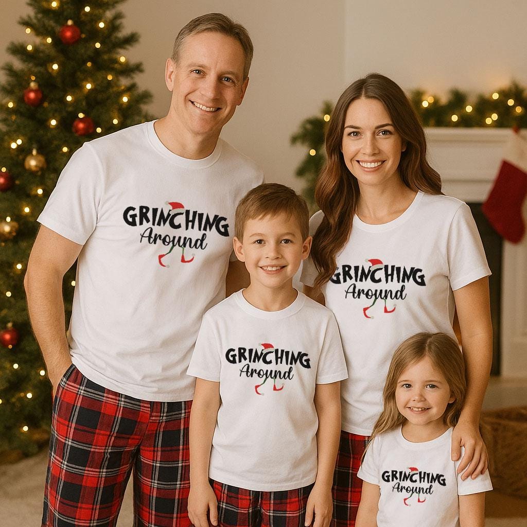 A family of four, consisting of a father, mother, and two children, posing for a photo in front of a Christmas tree. They are all wearing matching white t-shirts with the text "Grinching Around" printed on them.
