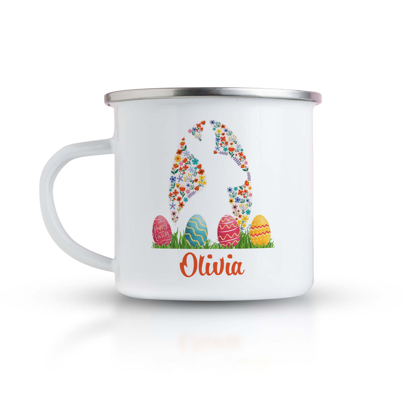 a white enamel mug with an image of an easter egg on it