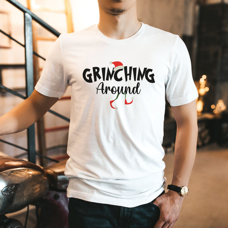 a man wearing a white shirt that says gringing around