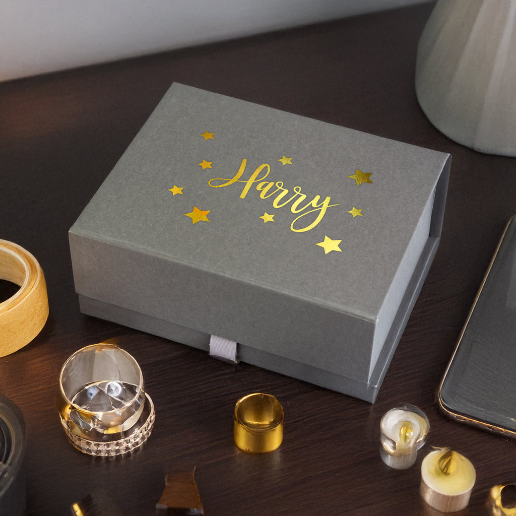 a box that has some gold foil on it