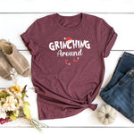 a t - shirt with the words grining around on it