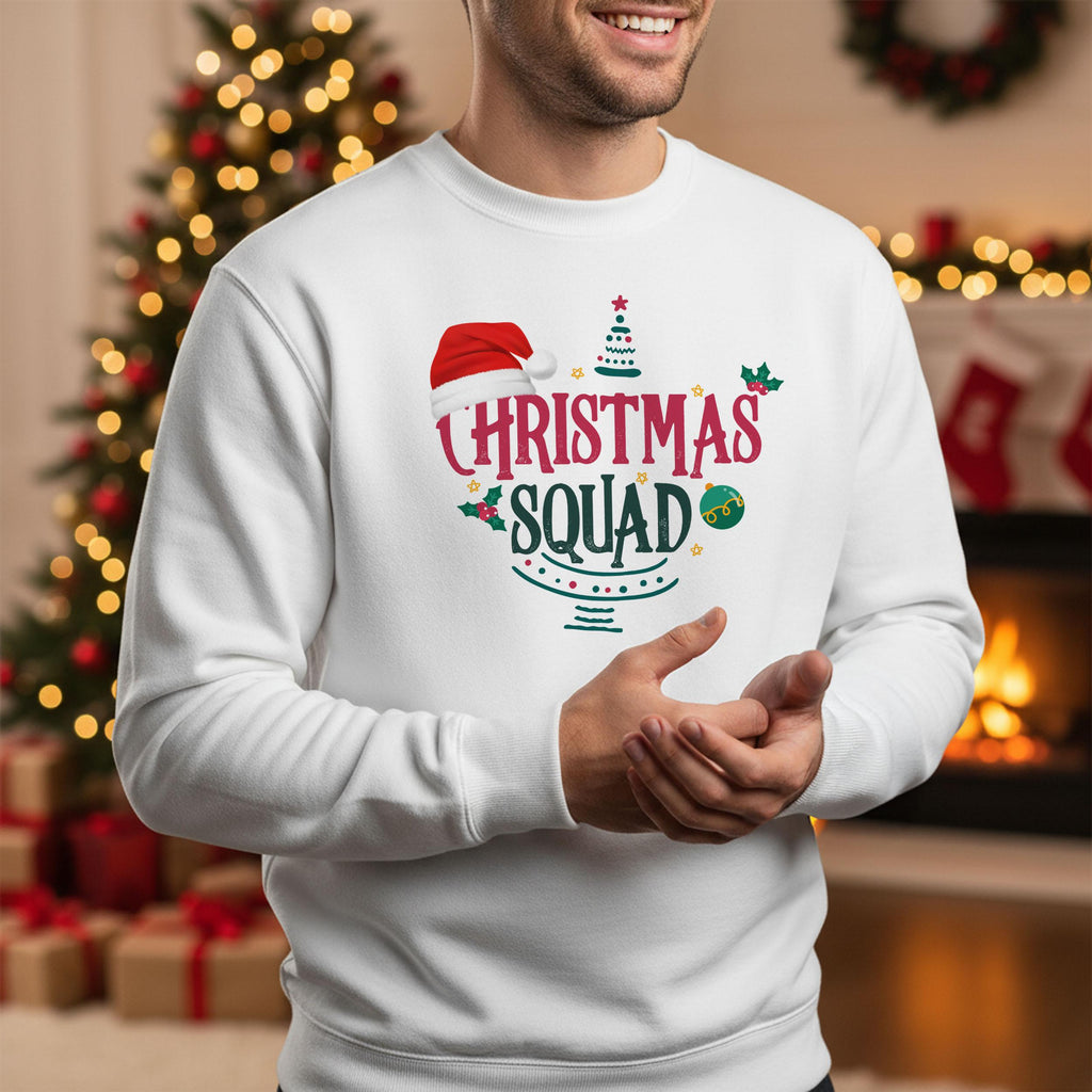 A man wearing a white sweater with a Christmas-themed design, including a Santa hat and the text &quot;Christmas Squad&quot;.