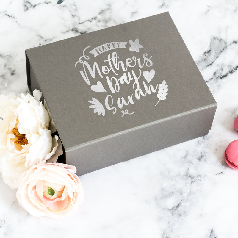 a mother's day card box with a flower next to it