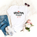 a t - shirt that says grining around next to a pair of jeans and