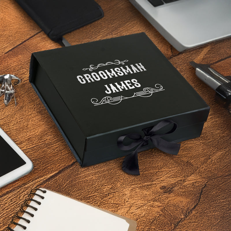 a black box sitting on top of a wooden table