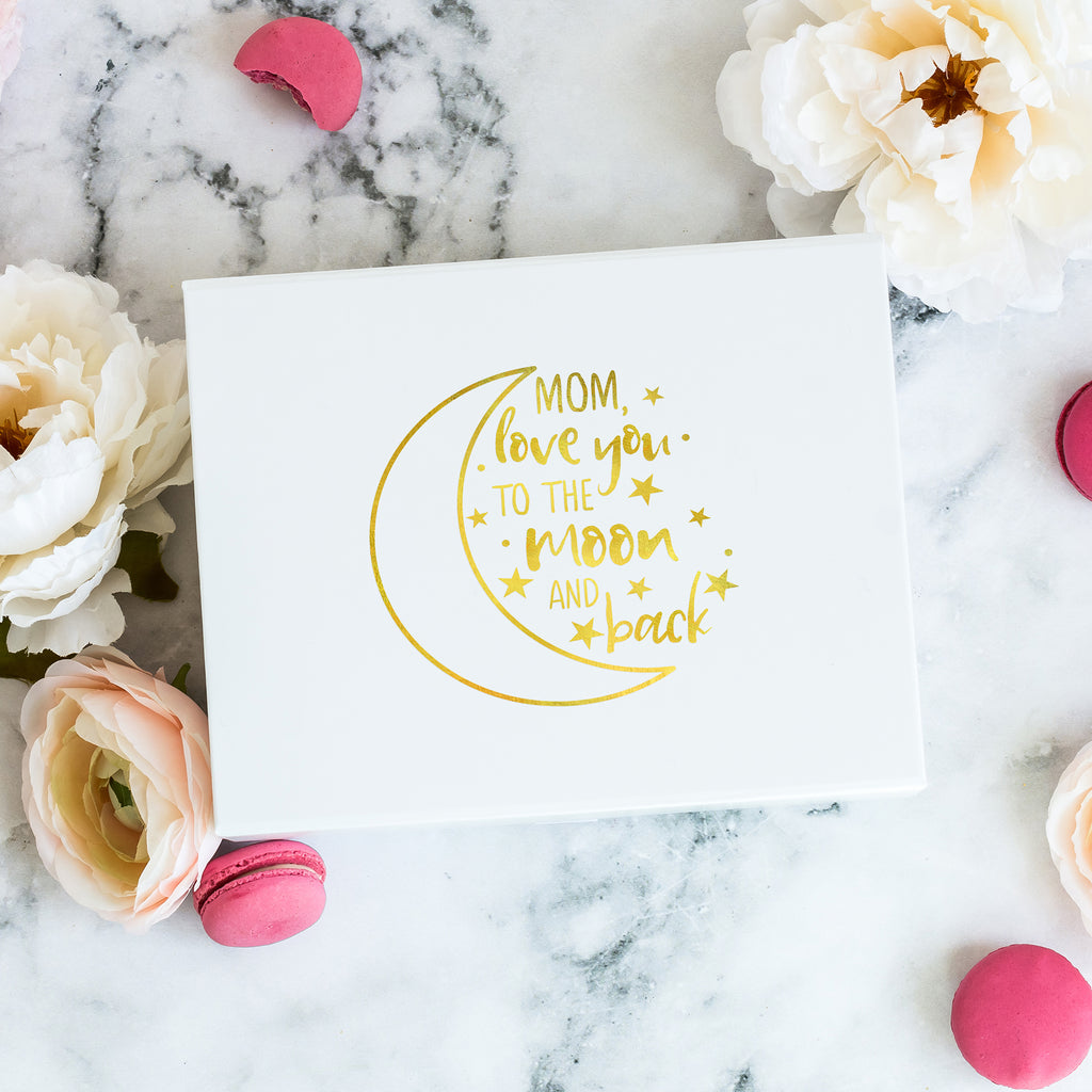 a mother's day card on a marble surface with flowers