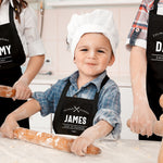 a little boy that is wearing a chef's hat
