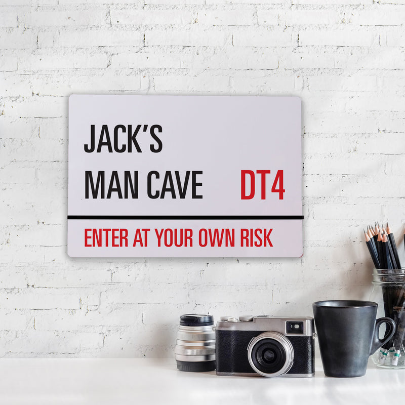 a sign that says jack's man cave on it