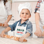 a little boy that is wearing a chef's hat