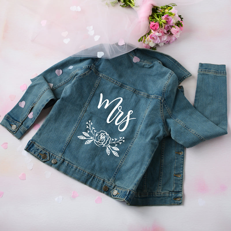 a denim jacket with the word mrs on it