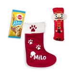 a red stocking with a dog's paw print and a red stocking