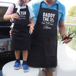 a man and a little girl wearing aprons