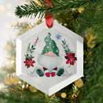 a glass ornament hanging from a christmas tree