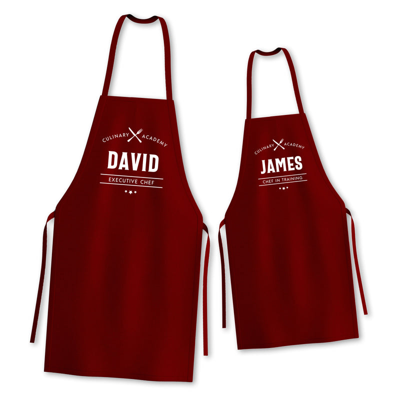 two red aprons with the words david and james on them