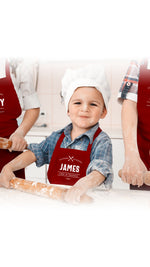 a little boy that is standing in front of some dough