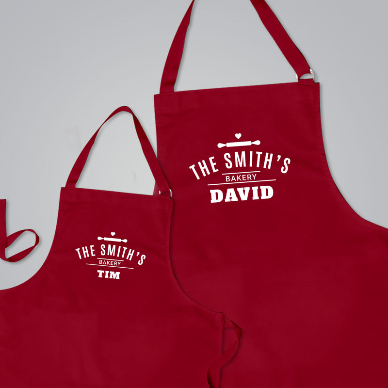 two red aprons with the words the smith's and the smith's